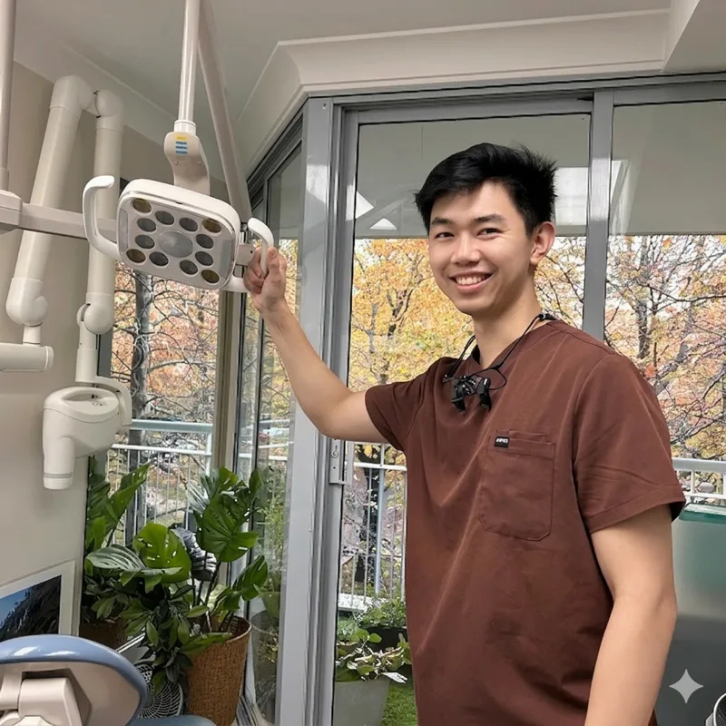 Dr George Liao, dentist in Canberra ACT, standing in professional attire
